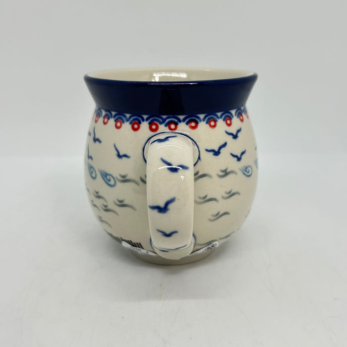 Close-up of the handle on an 11oz Ceramika Artystyczna bubble mug in the Unikat U5164 pattern, showing the blue lip and hand-stamped birds.