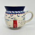 Front view of a large 16oz Ceramika Artystyczna bubble mug in the Unikat U5164 pattern, featuring a red lighthouse and a solid blue lip.