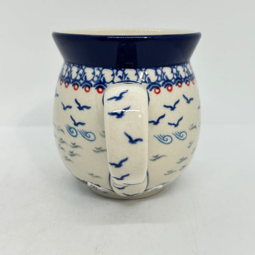Close-up of the handle on a large 16oz Ceramika Artystyczna bubble mug in the Unikat U5164 pattern, showing the blue lip, and birds.