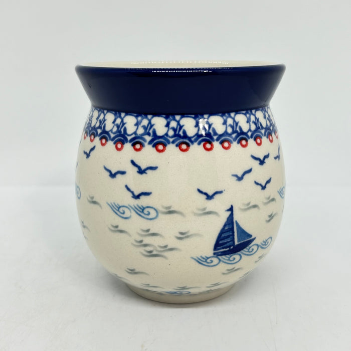 Side view of a large 16oz Ceramika Artystyczna Polish pottery bubble mug in the Unikat U5164 pattern, featuring a blue sailboat and waves.