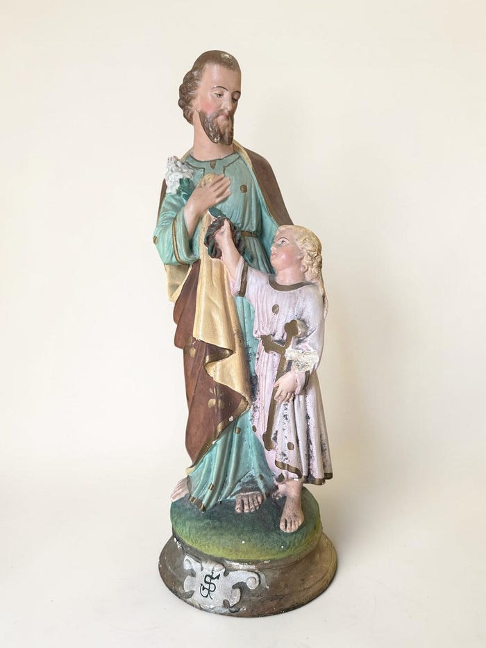 French plaster statue depicting Saint Joseph holding the Child Jesus