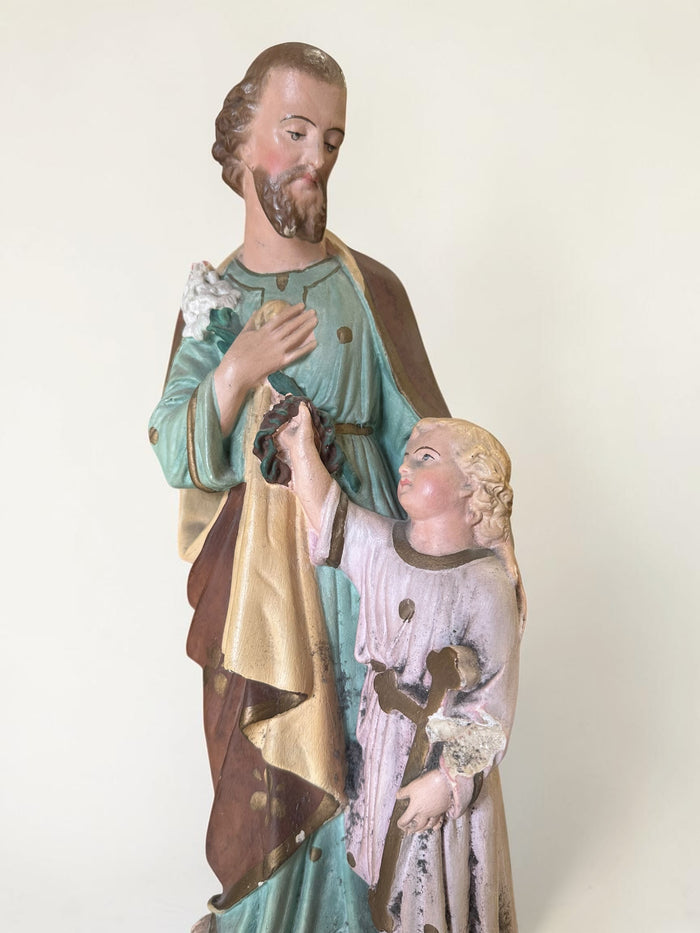 French plaster statue depicting Saint Joseph holding the Child Jesus