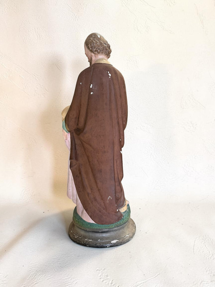 French plaster statue depicting Saint Joseph holding the Child Jesus