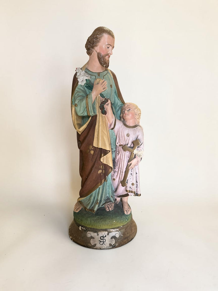 French plaster statue depicting Saint Joseph holding the Child Jesus