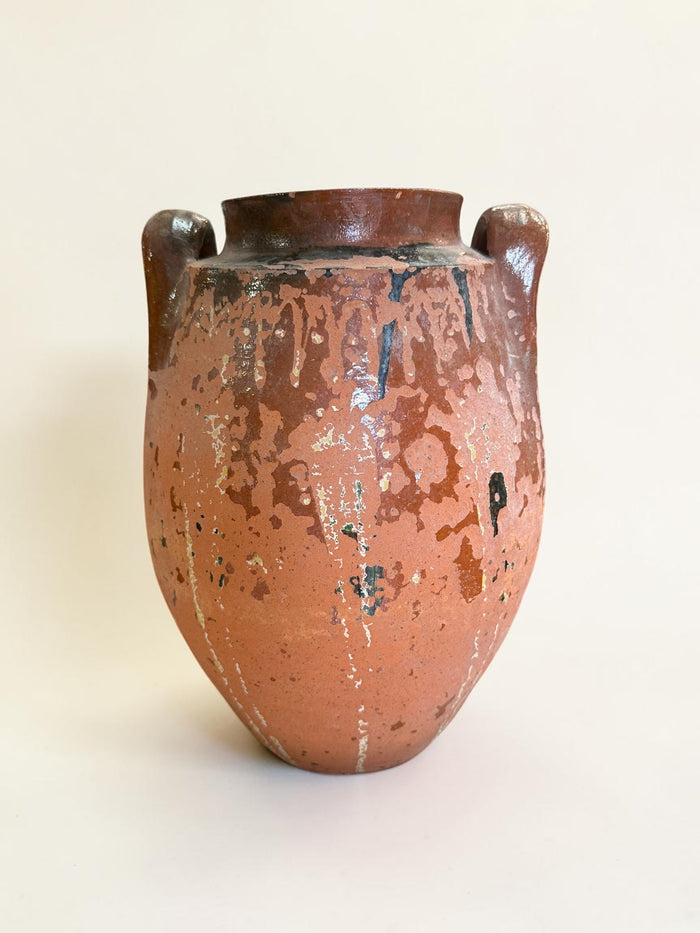 Rustic terracotta amphora jar