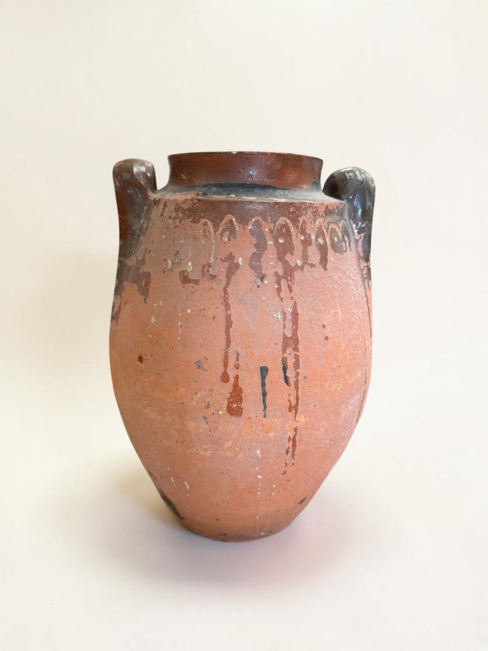 Rustic terracotta amphora jar