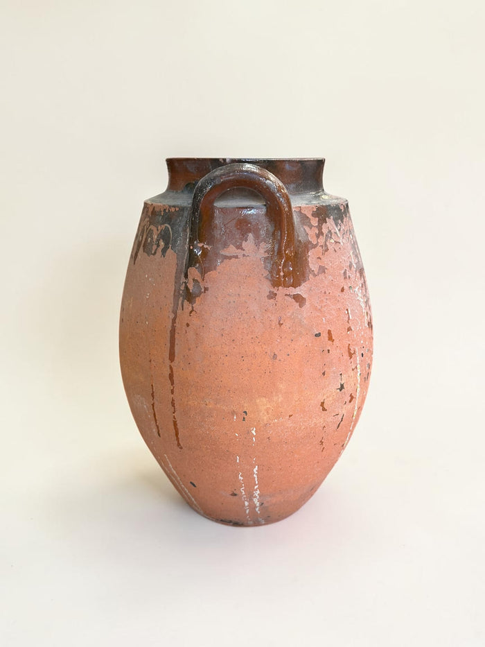 Rustic terracotta amphora jar