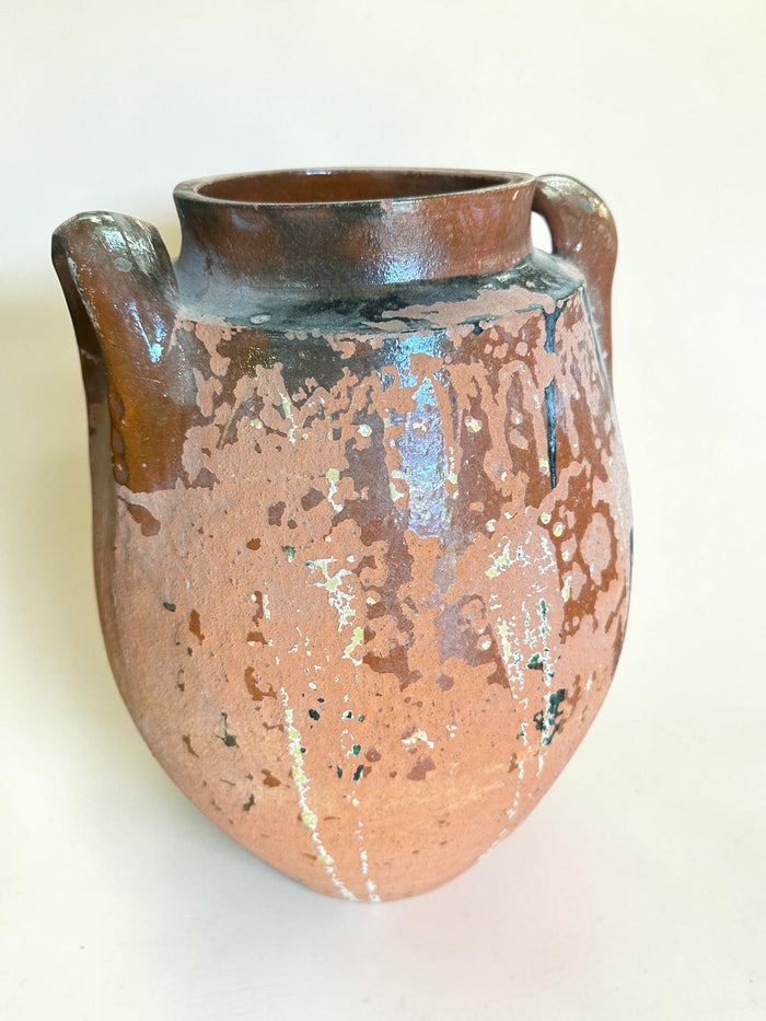 Rustic terracotta amphora jar